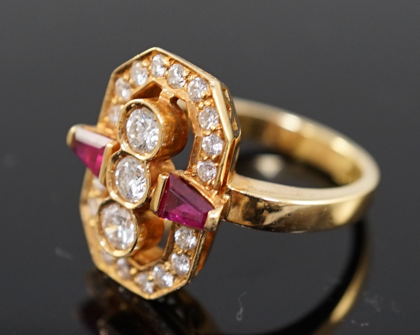 A modern gold, ruby and diamond cluster dress ring